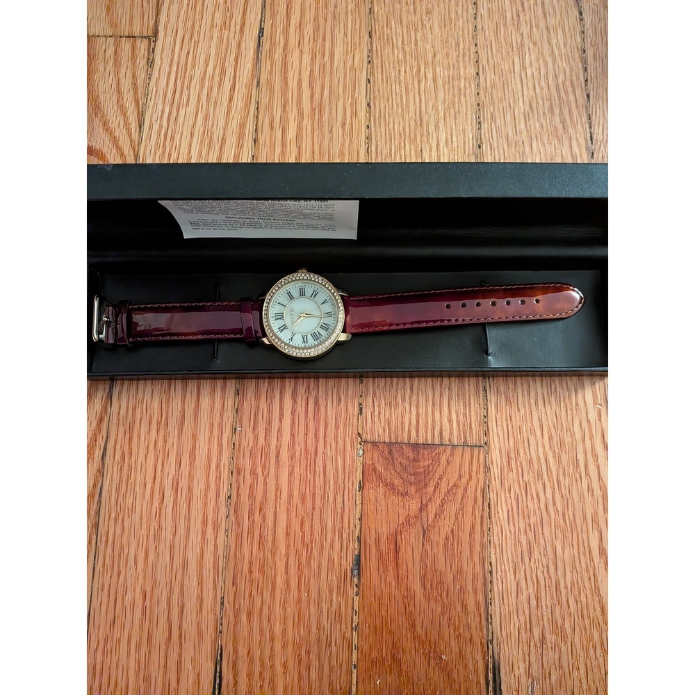 Gossip Womens Watch Gold Tone Crystal Bezel Burgundy Patent Strap Roman Numerals
